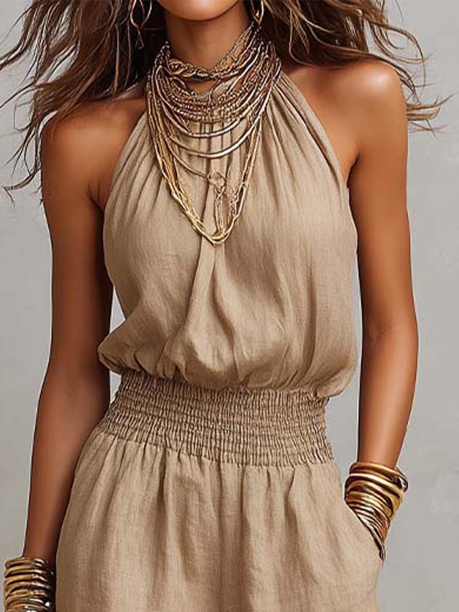 Beige jumpsuit with halter neck, gathered waist and wide-leg