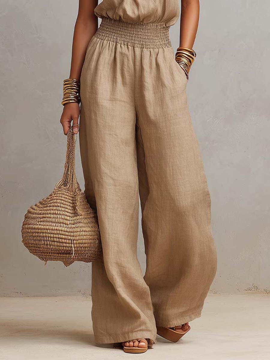Beige jumpsuit with halter neck, gathered waist and wide-leg
